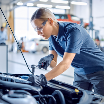 Mechanic working on car engine